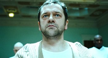 Movie still from “Bronson” (2008), directed by Nicolas Winding Refn – A person with a beard; Close Up shot, Low angle