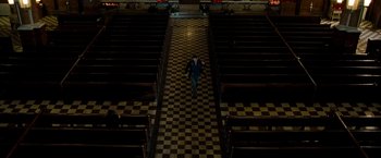 Movie still from “Brooklyn's Finest” (2009), directed by Antoine Fuqua – A man walking down the aisle of an empty church; Extreme Wide shot, High angle