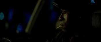 Movie still from “Brooklyn's Finest” (2009), directed by Antoine Fuqua – A person smoking a cigarette in a car; Close Up shot, Over the shoulder angle
