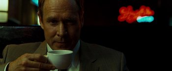 Movie still from “Brooklyn's Finest” (2009), directed by Antoine Fuqua – A person holding a cup of coffee; Close Up shot, Low angle