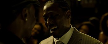 Movie still from “Brooklyn's Finest” (2009), directed by Antoine Fuqua – A person wearing a suit and tie; Close Up shot, Low angle