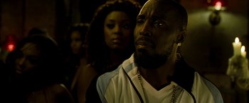 Movie still from “Brooklyn's Finest” (2009), directed by Antoine Fuqua – A man and a woman standing next to each other; Close Up shot, Over the shoulder angle