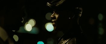 Movie still from “Brooklyn's Finest” (2009), directed by Antoine Fuqua – A man wearing a hat and a leather jacket; Close Up shot, Low angle