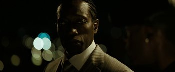 Movie still from “Brooklyn's Finest” (2009), directed by Antoine Fuqua – A person wearing a suit and tie; Close Up shot, Low angle