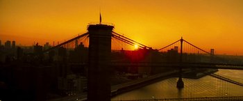Movie still from “Brooklyn's Finest” (2009), directed by Antoine Fuqua – The sun is setting over a bridge and a river; Extreme Wide shot, Low angle