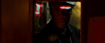 Movie still from “Brooklyn's Finest” (2009), directed by Antoine Fuqua – A man in a hat is reflected in a mirror; Close Up shot, Over the shoulder angle