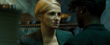 Movie still from “Brooklyn's Finest” (2009), directed by Antoine Fuqua – A person wearing a suit; Close Up shot, Over the shoulder angle