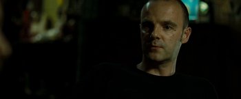 Movie still from “Brooklyn's Finest” (2009), directed by Antoine Fuqua – A person wearing a black t - shirt; Close Up shot, Low angle
