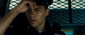 Movie still from “Brooklyn's Finest” (2009), directed by Antoine Fuqua – A man in a police officer's uniform looking at the camera; Close Up shot, High angle