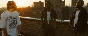 Movie still from “Brooklyn's Finest” (2009), directed by Antoine Fuqua – A man standing on the side of a brick wall; Medium shot, Low angle