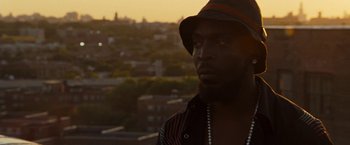 Movie still from “Brooklyn's Finest” (2009), directed by Antoine Fuqua – A man with a hat on looking at the camera; Close Up shot, Low angle