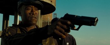 Movie still from “Brooklyn's Finest” (2009), directed by Antoine Fuqua – A man holding a gun while standing next to another man; Close Up shot, Low angle