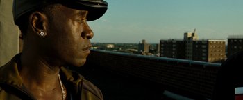 Movie still from “Brooklyn's Finest” (2009), directed by Antoine Fuqua – A man wearing a hat looking out over a city skyline; Close Up shot, Low angle