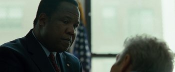 Movie still from “Brooklyn's Finest” (2009), directed by Antoine Fuqua – A man in a suit talking to a woman; Close Up shot, Over the shoulder angle