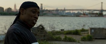 Movie still from “Brooklyn's Finest” (2009), directed by Antoine Fuqua – A man standing in front of a body of water; Close Up shot, Over the shoulder angle