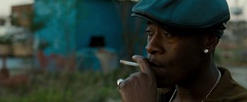 Movie still from “Brooklyn's Finest” (2009), directed by Antoine Fuqua – A man with a cigarette in his mouth and wearing a hat; Close Up shot, Low angle