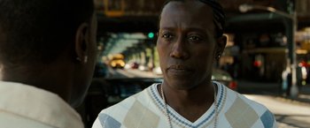 Movie still from “Brooklyn's Finest” (2009), directed by Antoine Fuqua – A person wearing a white shirt; Close Up shot, Over the shoulder angle