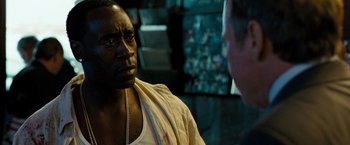 Movie still from “Brooklyn's Finest” (2009), directed by Antoine Fuqua – A man in a white shirt is talking to another man; Close Up shot, Over the shoulder angle