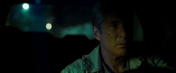 Movie still from “Brooklyn's Finest” (2009), directed by Antoine Fuqua – A person wearing a jacket; Close Up shot, Over the shoulder angle