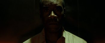 Movie still from “Brooklyn's Finest” (2009), directed by Antoine Fuqua – A person wearing a dress shirt; Close Up shot, Low angle