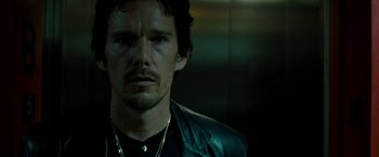 Movie still from “Brooklyn's Finest” (2009), directed by Antoine Fuqua – A person wearing a leather jacket; Close Up shot, Low angle