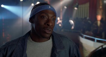 Movie still from “Brown Sugar” (2002), directed by Rick Famuyiwa – A person wearing a head band; Close Up shot, Low angle