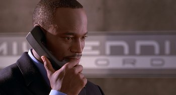 Movie still from “Brown Sugar” (2002), directed by Rick Famuyiwa – A man that is talking on the phone; Close Up shot, Low angle