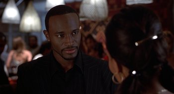 Movie still from “Brown Sugar” (2002), directed by Rick Famuyiwa – A man and a woman talking to each other; Close Up shot, Over the shoulder angle