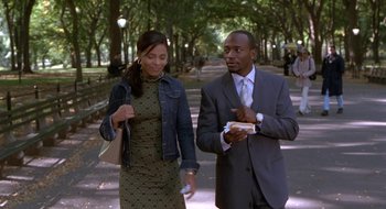 Movie still from “Brown Sugar” (2002), directed by Rick Famuyiwa – A man and a woman walking down a sidewalk; Medium shot, Over the shoulder angle