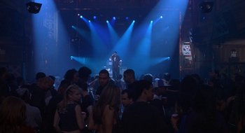 Movie still from “Brown Sugar” (2002), directed by Rick Famuyiwa – A group of people standing in front of stage lights; Extreme Wide shot, High angle