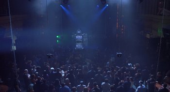 Movie still from “Brown Sugar” (2002), directed by Rick Famuyiwa – A crowd of people in a room with lights on; Extreme Wide shot, Overhead angle