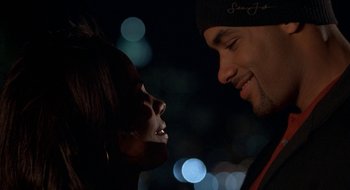 Movie still from “Brown Sugar” (2002), directed by Rick Famuyiwa – A man and a woman looking into each others eyes; Close Up shot, Over the shoulder angle