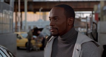 Movie still from “Brown Sugar” (2002), directed by Rick Famuyiwa – A person wearing a jacket; Close Up shot, High angle