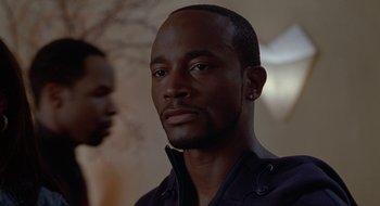 Movie still from “Brown Sugar” (2002), directed by Rick Famuyiwa – A person wearing a black shirt; Close Up shot, Low angle