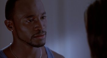 Movie still from “Brown Sugar” (2002), directed by Rick Famuyiwa – A person wearing headphones; Close Up shot, Low angle
