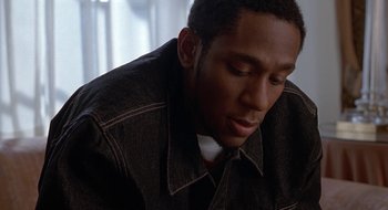 Movie still from “Brown Sugar” (2002), directed by Rick Famuyiwa – A person wearing a jacket; Close Up shot, Low angle