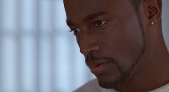 Movie still from “Brown Sugar” (2002), directed by Rick Famuyiwa – A man's face with a white background; Close Up shot, High angle