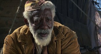 Movie still from “Buck and the Preacher” (1972), directed by Joseph Sargent – An older man with a beard and a hat; Close Up shot, High angle