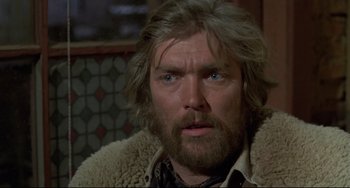 Movie still from “Buck and the Preacher” (1972), directed by Joseph Sargent – A person wearing a jacket; Close Up shot, Low angle