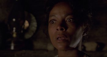 Movie still from “Buck and the Preacher” (1972), directed by Joseph Sargent – A person looking at the camera; Close Up shot, Low angle