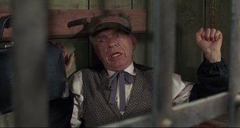 Movie still from “Buck and the Preacher” (1972), directed by Joseph Sargent – An older man wearing a hat and a vest; Close Up shot, Overhead angle