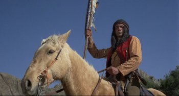 Movie still from “Buck and the Preacher” (1972), directed by Joseph Sargent – A man on a horse with a spear in his hand; Medium shot, Low angle