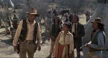 Movie still from “Buck and the Preacher” (1972), directed by Joseph Sargent – A group of people walking down a dirt road; Medium shot, Low angle