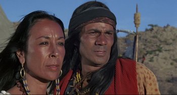 Movie still from “Buck and the Preacher” (1972), directed by Joseph Sargent – A man and a woman standing next to each other; Close Up shot, High angle