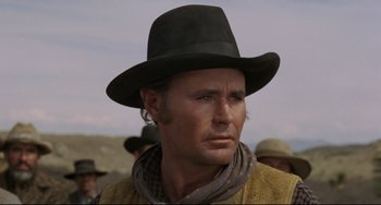 Movie still from “Buck and the Preacher” (1972), directed by Joseph Sargent – A person wearing a hat; Close Up shot, Low angle