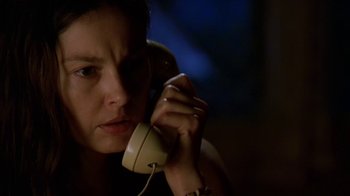 Movie still from “Bug” (2006), directed by William Friedkin – A woman holding a phone up to her ear; Close Up shot, Low angle