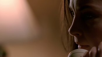 Movie still from “Bug” (2006), directed by William Friedkin – A woman's face with a phone in her ear; Extreme Close Up shot, Low angle