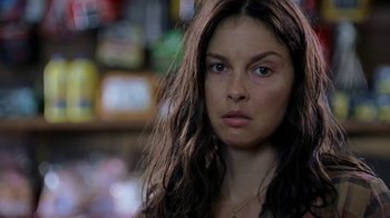 Movie still from “Bug” (2006), directed by William Friedkin – A person with long brown hair; Close Up shot, Over the shoulder angle