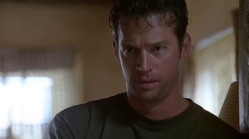 Movie still from “Bug” (2006), directed by William Friedkin – A person with a nose ring; Close Up shot, Over the shoulder angle