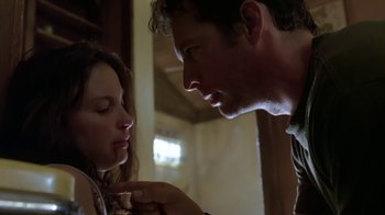 Movie still from “Bug” (2006), directed by William Friedkin – A man and a woman looking at one another; Close Up shot, Low angle